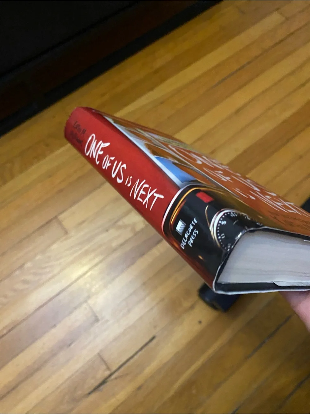 One of Us Is Next by Karen M. McManus - Red Hardcover Book